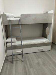 a bunk bed with two bunk beds in a room at BALISTRERI HOUSe in Trabia +1 photo