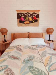 Giường trong phòng chung tại villa luz de vida