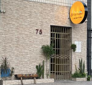 a brick building with a number on it at Pousada Sol de Iracema Praia in Fortaleza