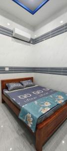 En eller flere senge i et værelse på Arasam Homestay Bình An