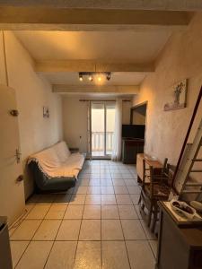 En eller flere senge i et værelse på Le Petit Coin de Noël