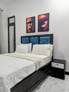 Ένα ή περισσότερα κρεβάτια σε δωμάτιο στο BSM Residence