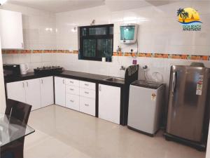 Kuchyň nebo kuchyňský kout v ubytování Goa Beach Apartment