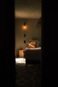 Ένα ή περισσότερα κρεβάτια σε δωμάτιο στο Le Domaine de la mer - Beach hotel Nature&Authenticité Hyères