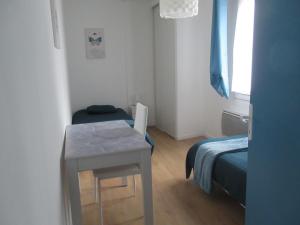 Ένα ή περισσότερα κρεβάτια σε δωμάτιο στο Gîte la Chaumette appartement Turquoise