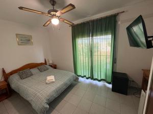 Ένα ή περισσότερα κρεβάτια σε δωμάτιο στο Hotel El Pescador