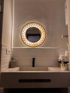 a bathroom with a sink and a mirror at Casa Norte in Tétouan +10 photos