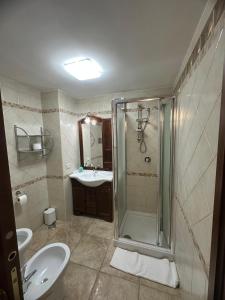 a bathroom with a shower and a toilet and a sink at Princess Mafalda house in Grottaglie