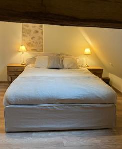 Ένα ή περισσότερα κρεβάτια σε δωμάτιο στο Sur Les Roches