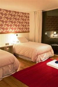 Postel nebo postele na pokoji v ubytování Hotel Casa Zapallar