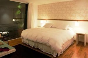 Postel nebo postele na pokoji v ubytování Hotel Casa Zapallar