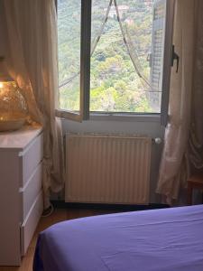 Ένα ή περισσότερα κρεβάτια σε δωμάτιο στο 4VENTI by LigurianLife +24 φωτογραφίες