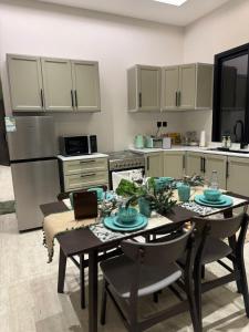 Kuchyň nebo kuchyňský kout v ubytování شقق اوليفيا الفاخرة