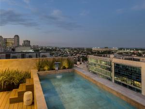 a swimming pool on the roof of a building at Casa Joseph Libertador in Buenos Aires