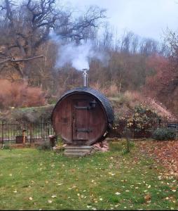 a small house with smoke coming out of it at Wohnen auf dem Rittergut Friedeburg - mit direkter Nähe zur Saale in Gerbstedt
