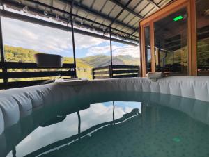 a swimming pool with a view of the mountains at Apartma Manca in Jesenice na Dolenjskem