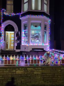 a house with christmas lights on the front of it at MyRoomz Tudor Rose Original in Blackpool
