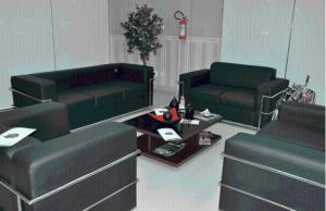 a living room with two couches and a table at Skala Traveling Hotel in Cuiabá
