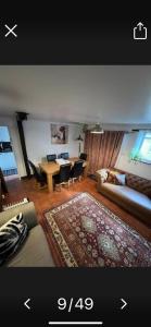 a living room with a couch and a table at The Old Hanging Gate Inn in Madeley