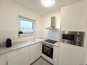 Η κουζίνα ή μικρή κουζίνα στο HUGOS Design Apartment