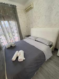 Un pat sau paturi într-o cameră la Gioeni PARK HOUSE