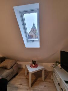 Μια τηλεόραση ή/και κέντρο ψυχαγωγίας στο Ferienwohnung Heppenheim an der Bergstraße WHG 4