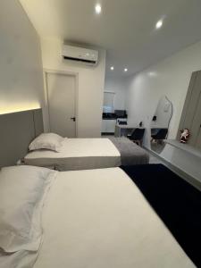 En eller flere senge i et værelse på Vila Eco Barra AP 209