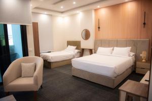 Ένα ή περισσότερα κρεβάτια σε δωμάτιο στο Lotus Luxury Apartments