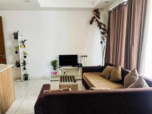 Телевизор и/или развлекательный центр в city view apartment at Capitol twinpeak