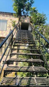 een trap naar een gebouw bij AERON kabila Resort in Sītāpur