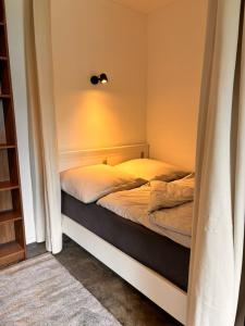 Postel nebo postele na pokoji v ubytování Mikro-Apartmenthaus Lübeck