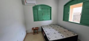 En eller flere senge i et værelse på Casa Temporada Maré Alta