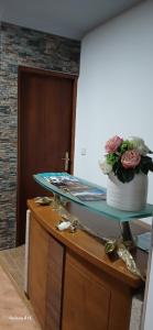 a table with a cake and flowers on top of it at Ferradosa GuestHouse in São João da Pesqueira +69 photos