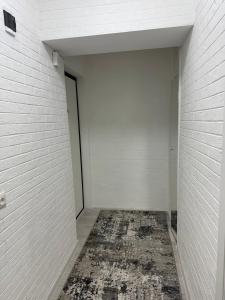 an empty hallway with white walls and a door at Apartament cu 1 camera in Soroca