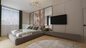 a bedroom with a bed and a flat screen tv at Aqua & Wellness resort Alzbeta in Liptovský Mikuláš +44 photos