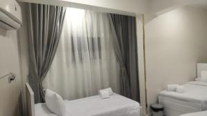 En eller flere senge i et værelse på Aswan Key Cozy + 12 billeder