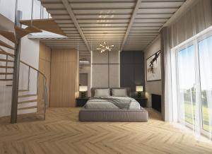 a bedroom with a bed and a large window at Aqua & Wellness resort Alzbeta in Liptovský Mikuláš