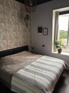 En eller flere senge i et værelse på Appartement B&B In de Gulde Steur