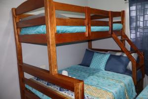 a couple of bunk beds in a room at Costabay in El Zapote +38 photos