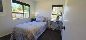 Ένα ή περισσότερα κρεβάτια σε δωμάτιο στο Bumble Bee Cottage