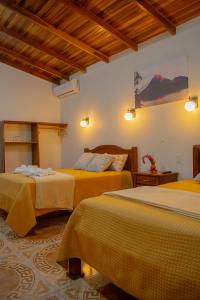 Postel nebo postele na pokoji v ubytování Arenal Descanso + 95 fotografií