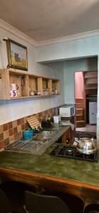 a kitchen with a counter and a stove top oven at Mountain Haven Kaapsehoop in Kaapsehoop
