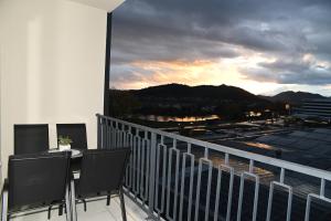 a balcony with a table and chairs on a balcony at Apartman Perfect in Trebinje