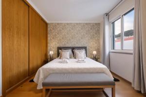 En eller flere senge i et værelse på Sunflower Stay by Homie + 22 billeder