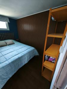 Una cama o camas en una habitación de cabaña Yapide2, puerto varas