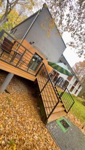 a building with a staircase in front of it at Apartamenty Dąbrówka Cieplice Zdrój 1,15 in Jelenia Góra +25 photos