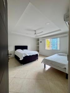 Ένα ή περισσότερα κρεβάτια σε δωμάτιο στο Oasis de Ricaurte