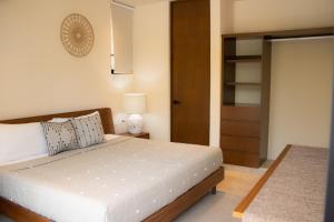 Ένα ή περισσότερα κρεβάτια σε δωμάτιο στο Peregrina Tulum 202A 2BR Luxury Condo +50 φωτογραφίες