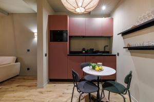 a small kitchen with a table and chairs in a room at Wonderful Stay close to Garibaldi - Aircon in Nice