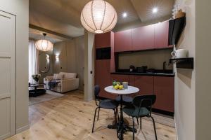 a kitchen and living room with a table and chairs at Wonderful Stay close to Garibaldi - Aircon in Nice